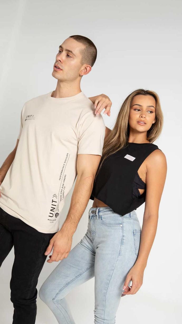 Man wearing UNIT Men's Tee Cyber in Cement colour with attractive lady
